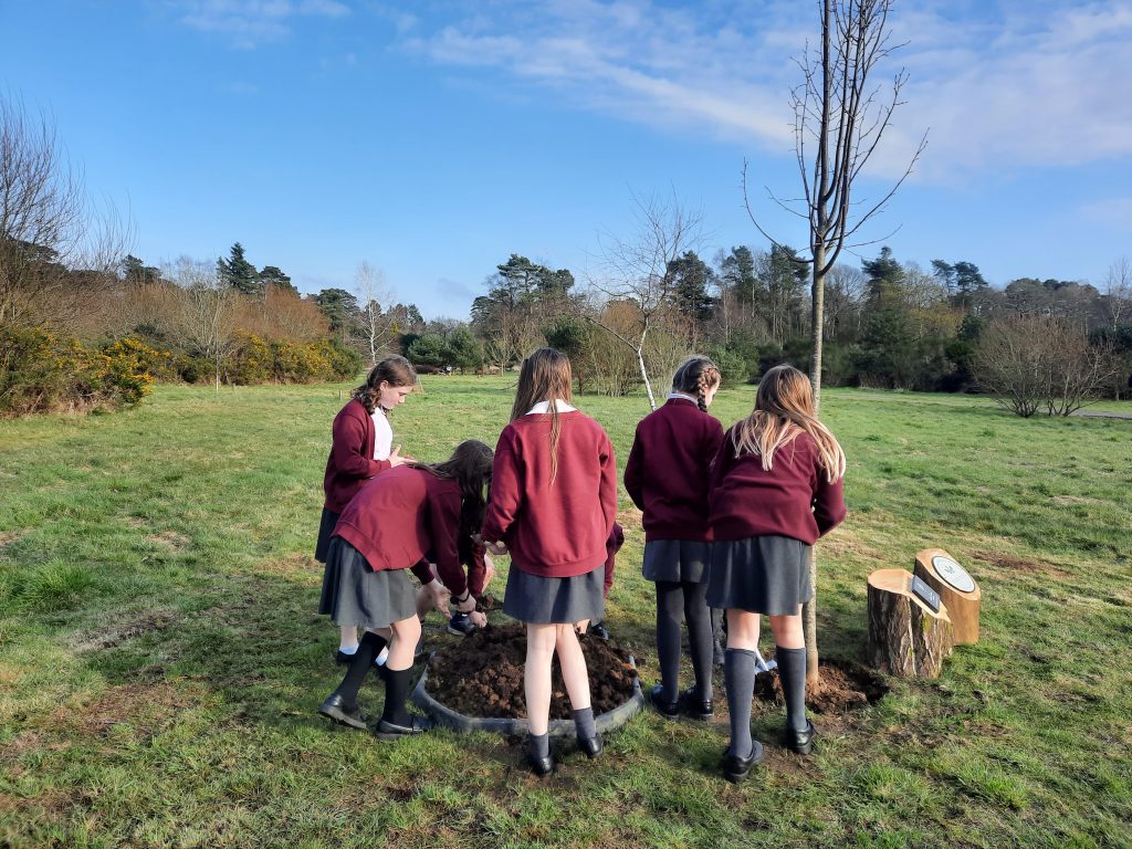 The House Captains from local Grayshott CE Primary School planting tree